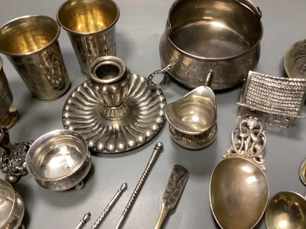 A late 19th century Russian gilt 84 zolotnik tea cup and saucer, dated 1883, a pair of similar salts and a group of other items.